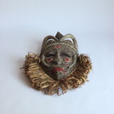 African mask with raffia and kaolin dots