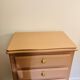 Pink wooden chest of drawers