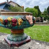 Large neoclassical majolica jardinière with ram's heads.