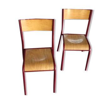Red tubular school chairs