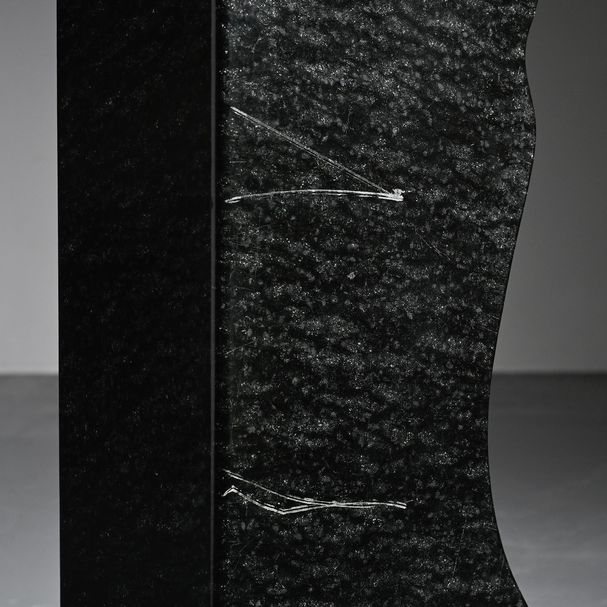 Abstract sculpture in diabase by Robert Neuhauser, Switzerland, circa 1985.