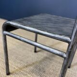 Pair of gray metal industrial chairs