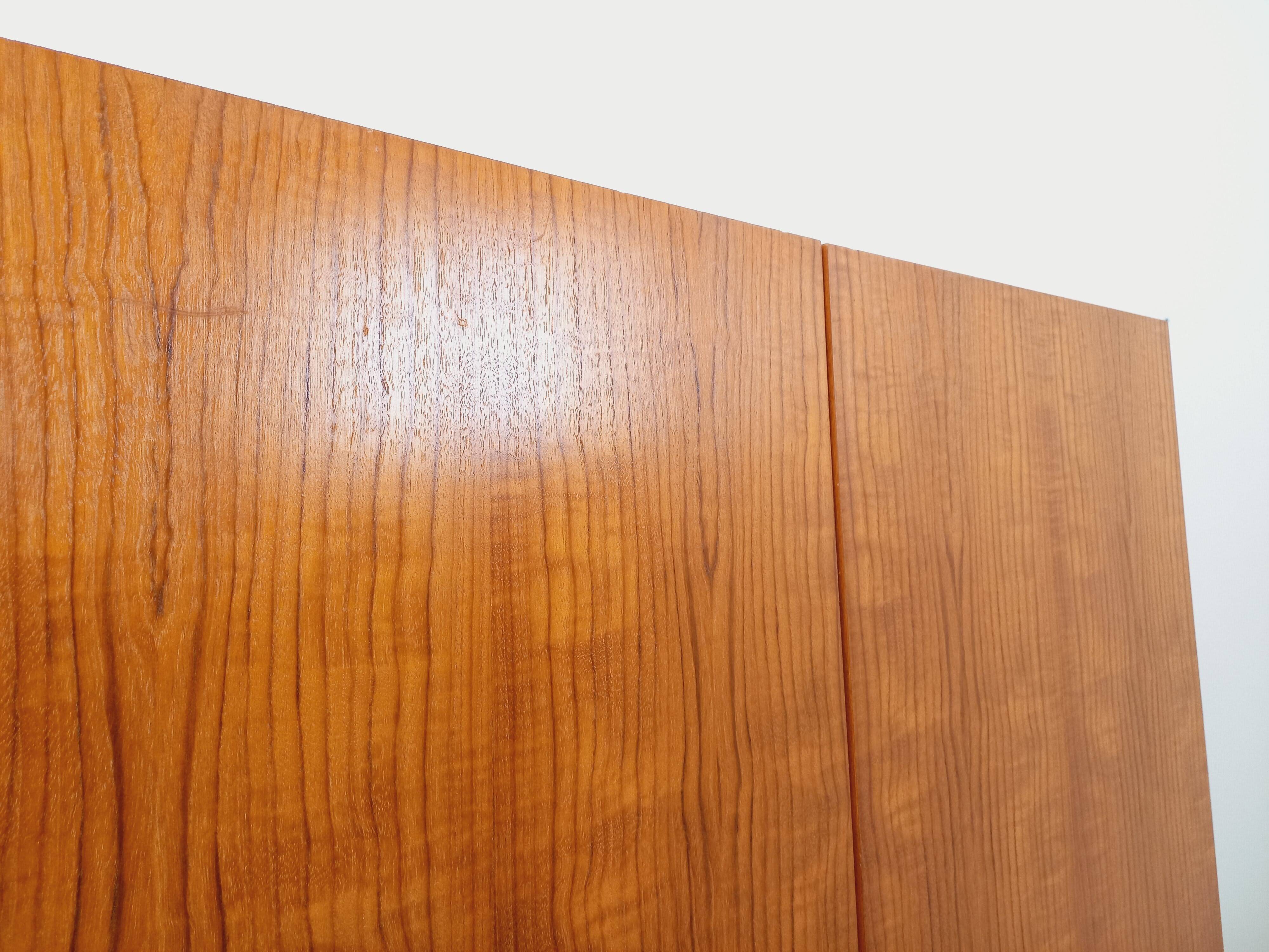 Vintage modernist wardrobe in teak and metal from the 1960s.