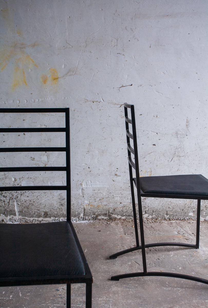 Set of 4 Black Steel Dining Chairs with Black Faux-Leather Seats — Minimalist Geometric Design