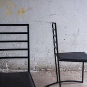 Set of 4 Black Steel Dining Chairs with Black Faux-Leather Seats — Minimalist Geometric Design