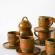 Glazed stoneware coffee service consisting of a coffee pot and 5 cups.
