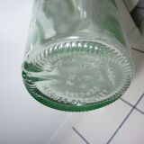 Bouteille ancienne en verre moulée transparente