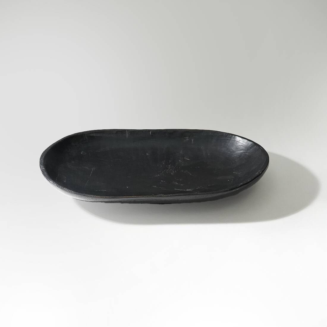 Organic shaped black wooden bowl, 1960s
