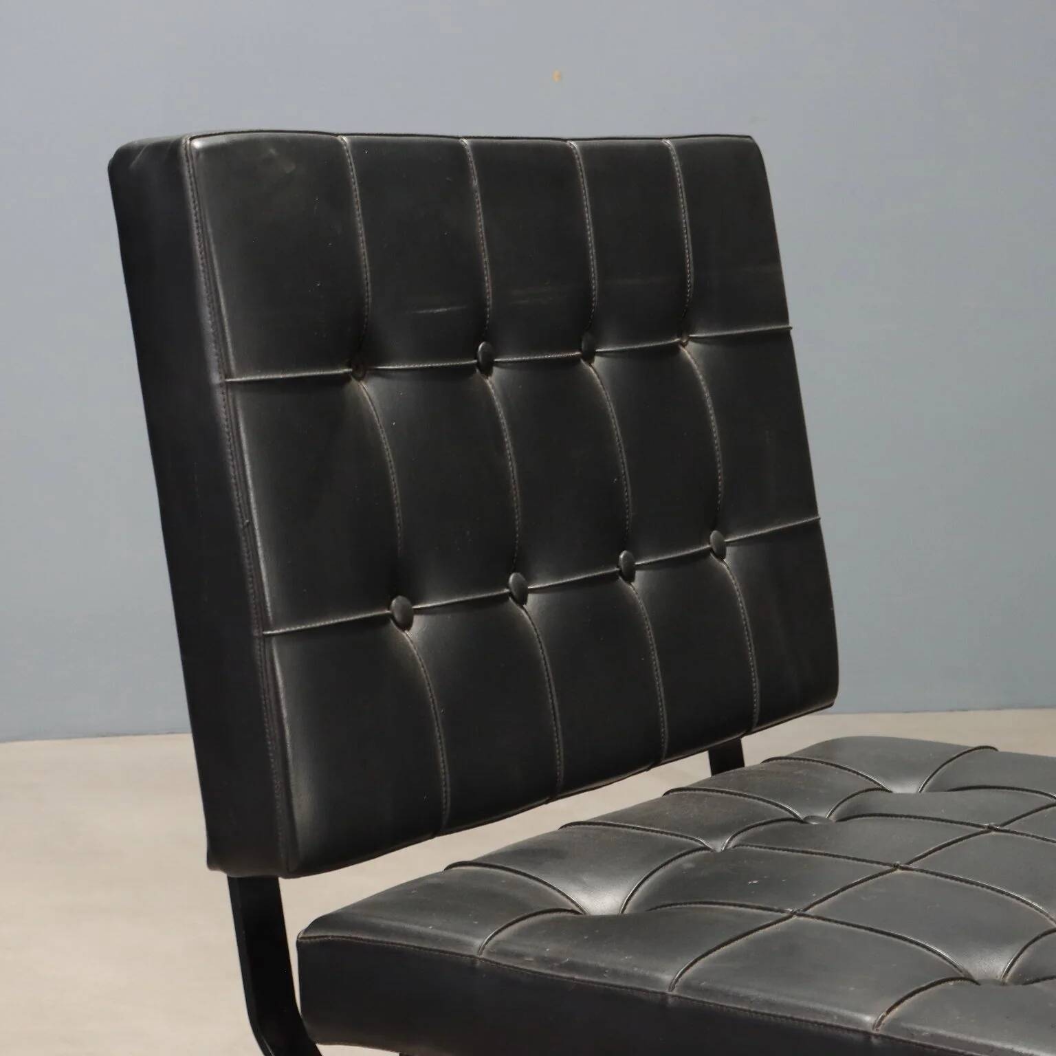 Vintage armchair in metal and black faux leather, Italian design from the 1970s.