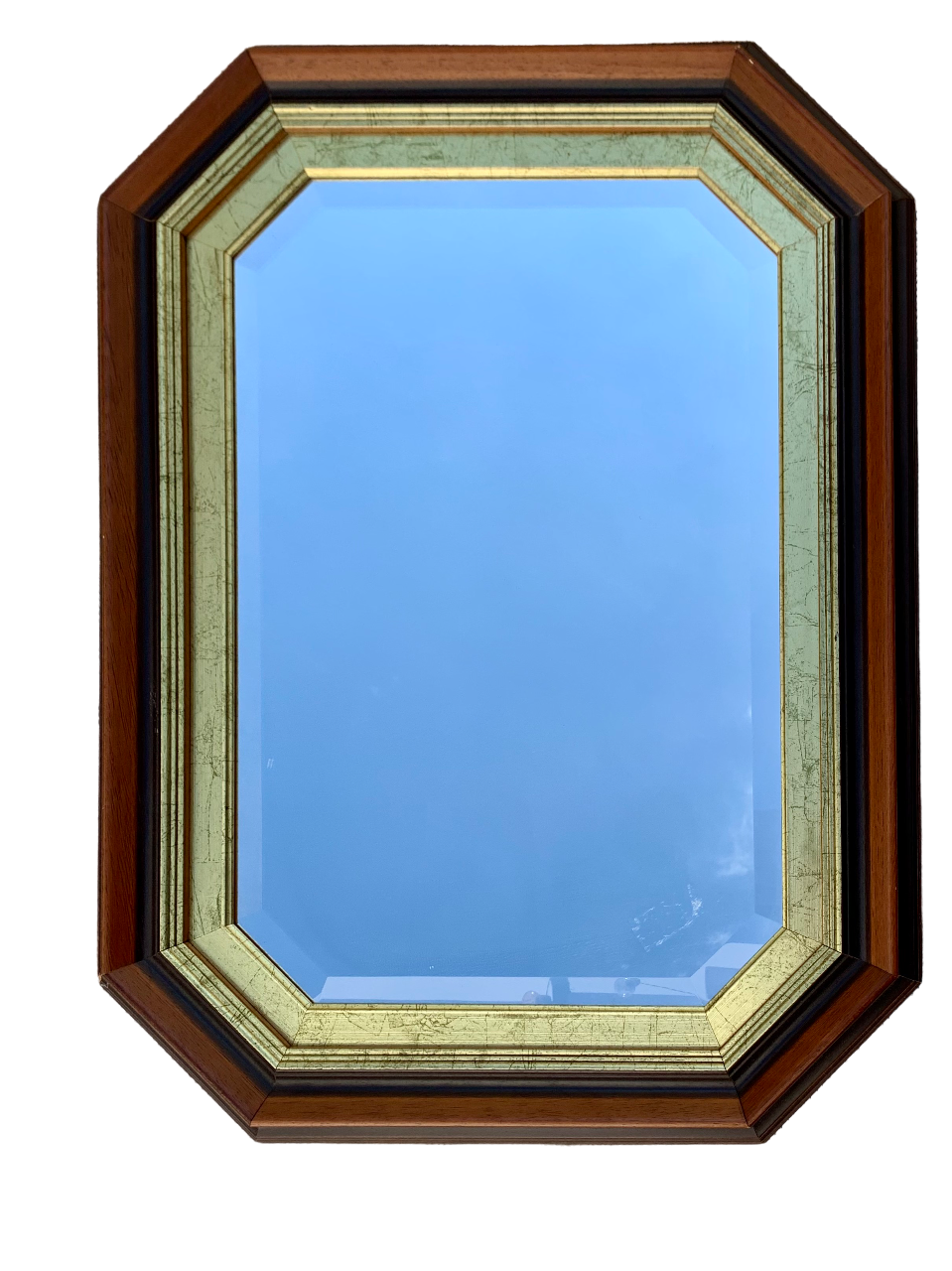 Beveled hexagonal mirror with cut wooden sides, gilded edging decoration