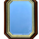 Beveled hexagonal mirror with cut wooden sides, gilded edging decoration