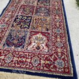Vintage mechanical Turkish rug with box decoration on a red and navy blue background 139 x 68 cm