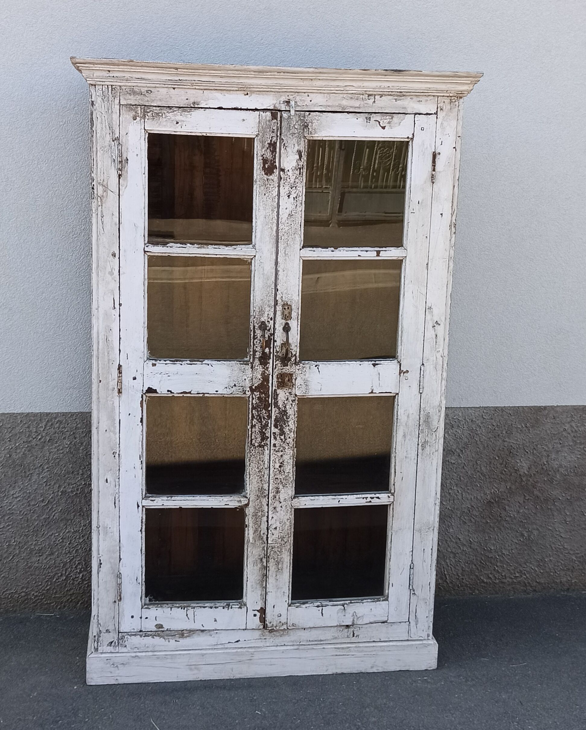 White wooden antique glazed wardrobe