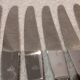 12 silver-plated dessert knives by St Medard, rocaille style, Florian.