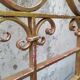 Golden wrought iron bedhead