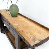 Brown painted workbench with shelf and drawers