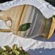 Handcrafted jug or jar with a handle, terracotta pottery vase, fat lava effect, stylized flowers