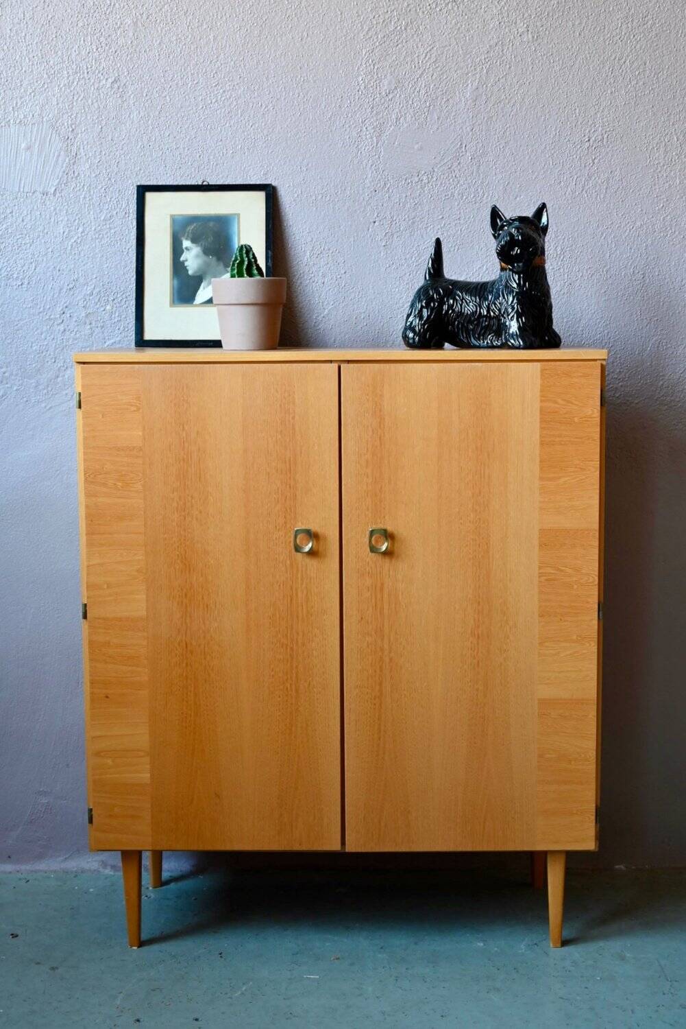 Vintage 1960s shoe cabinet in light wood and chrome metal.