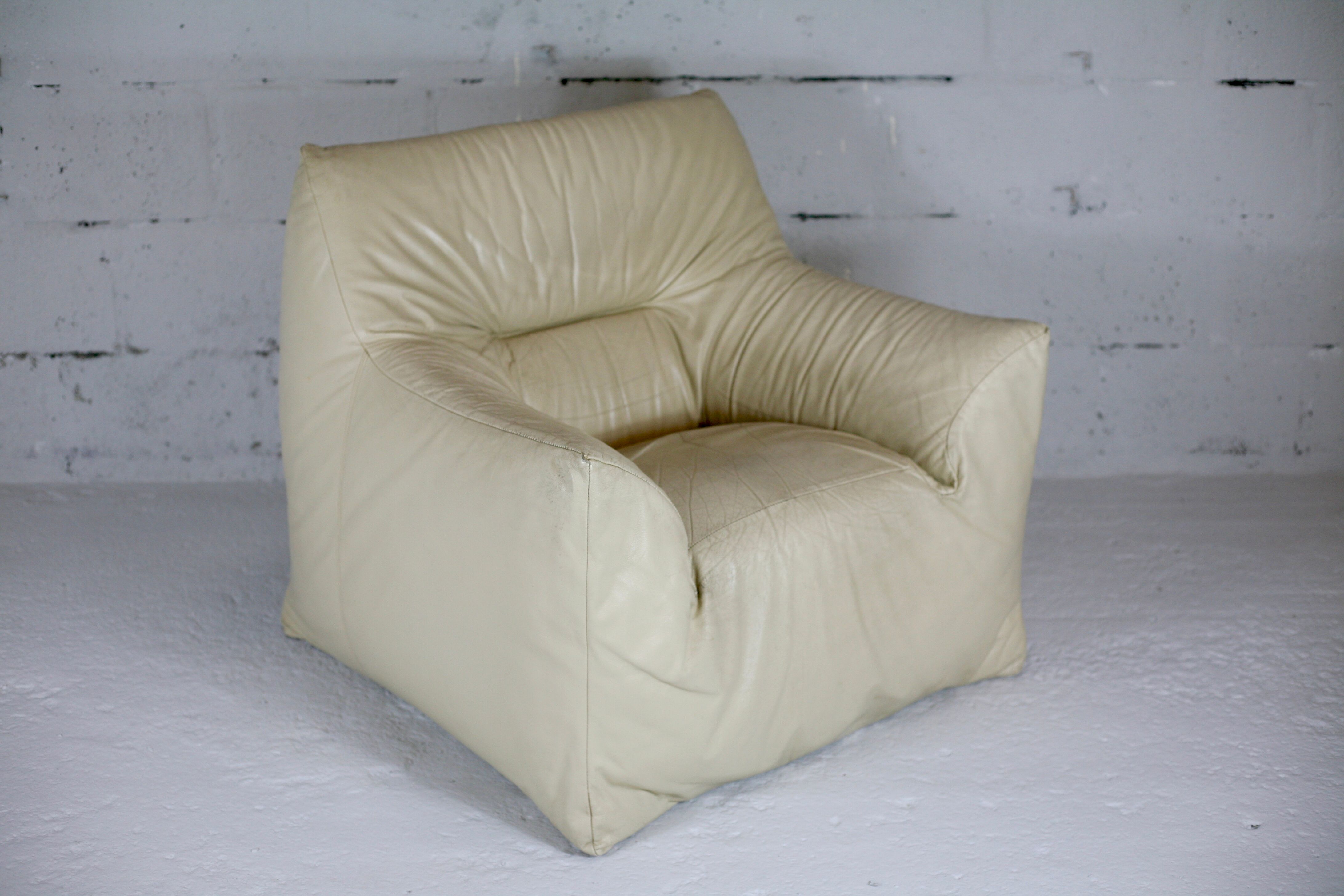 Leather armchair and cream-coloured foam, France , circa 1970