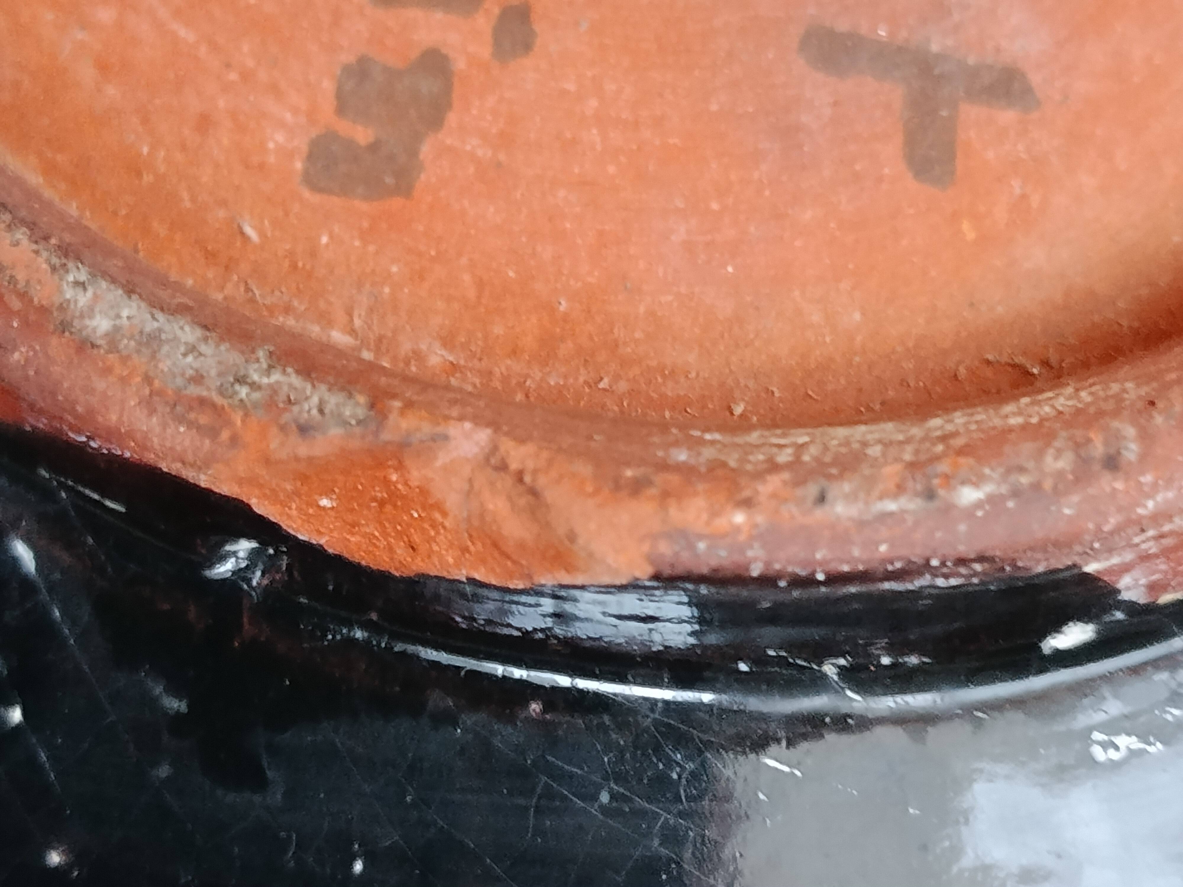 Large stoneware platter signed c. pitot, mid-20th century, black, white, and red glazed ceramic