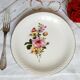 Flat earthenware plates with gilded edges