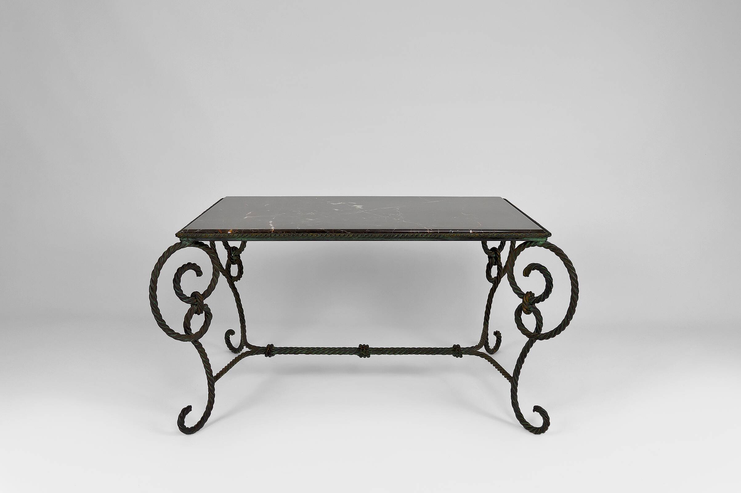 Coffee table in patinated wrought iron and black marble, circa 1940