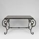 Coffee table in patinated wrought iron and black marble, circa 1940