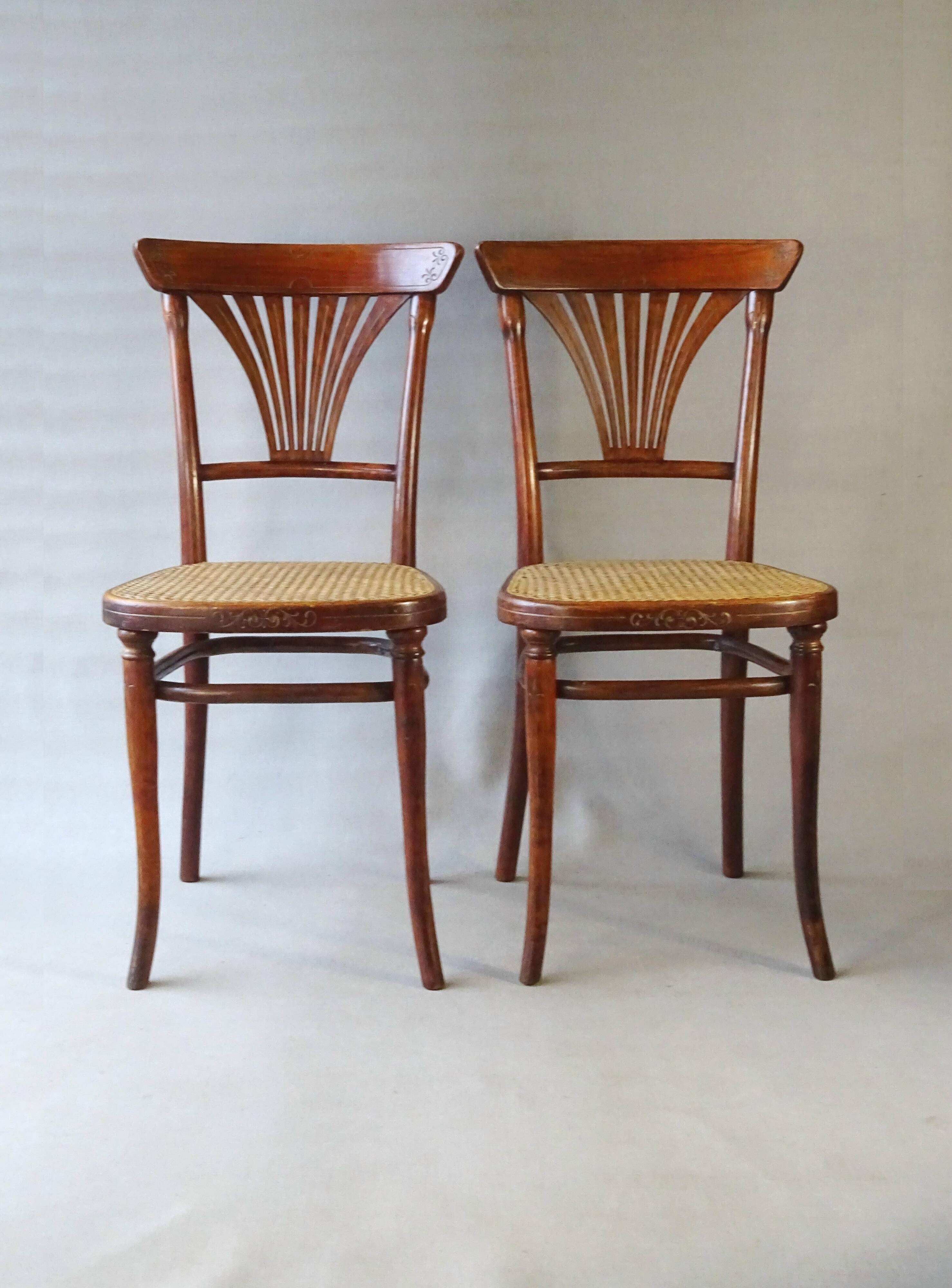 2 Thonet N°221 chairs, caned Art Nouveau bronze decor