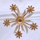 Vintage wrought iron chandelier decorated with golden and beige reeds