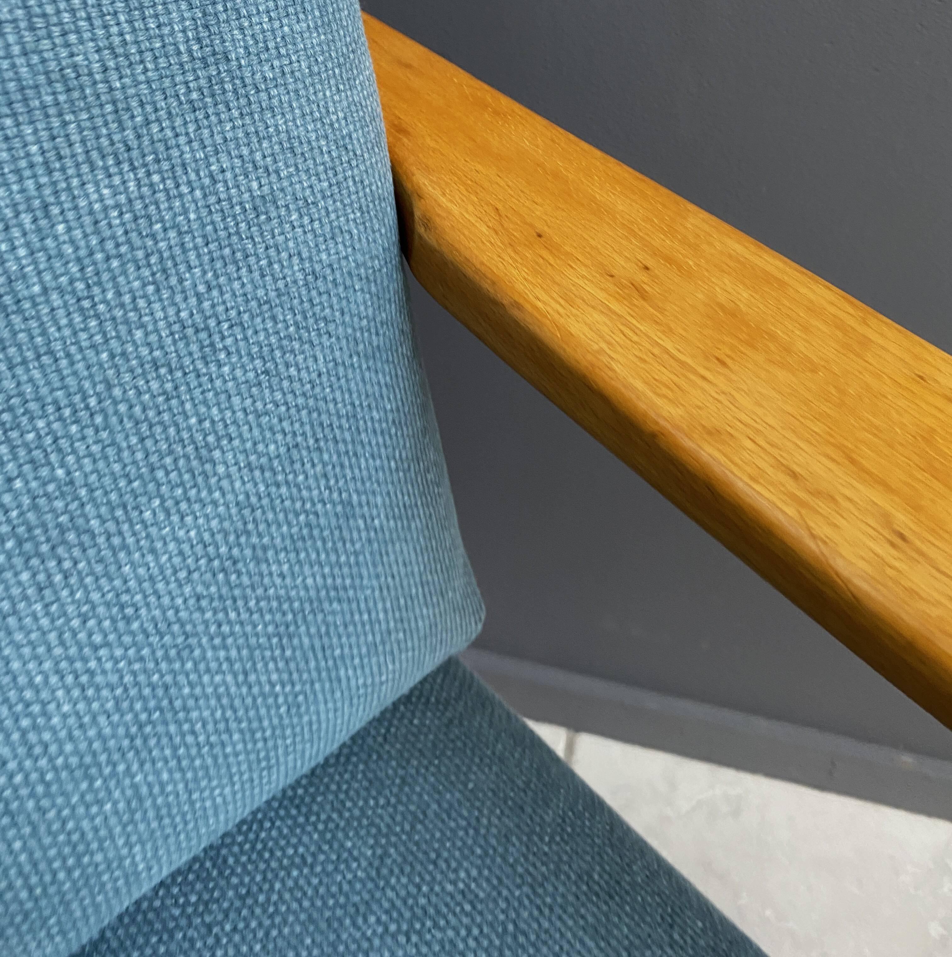 Wood arm chair reupholstered in blue fabric 1960s
