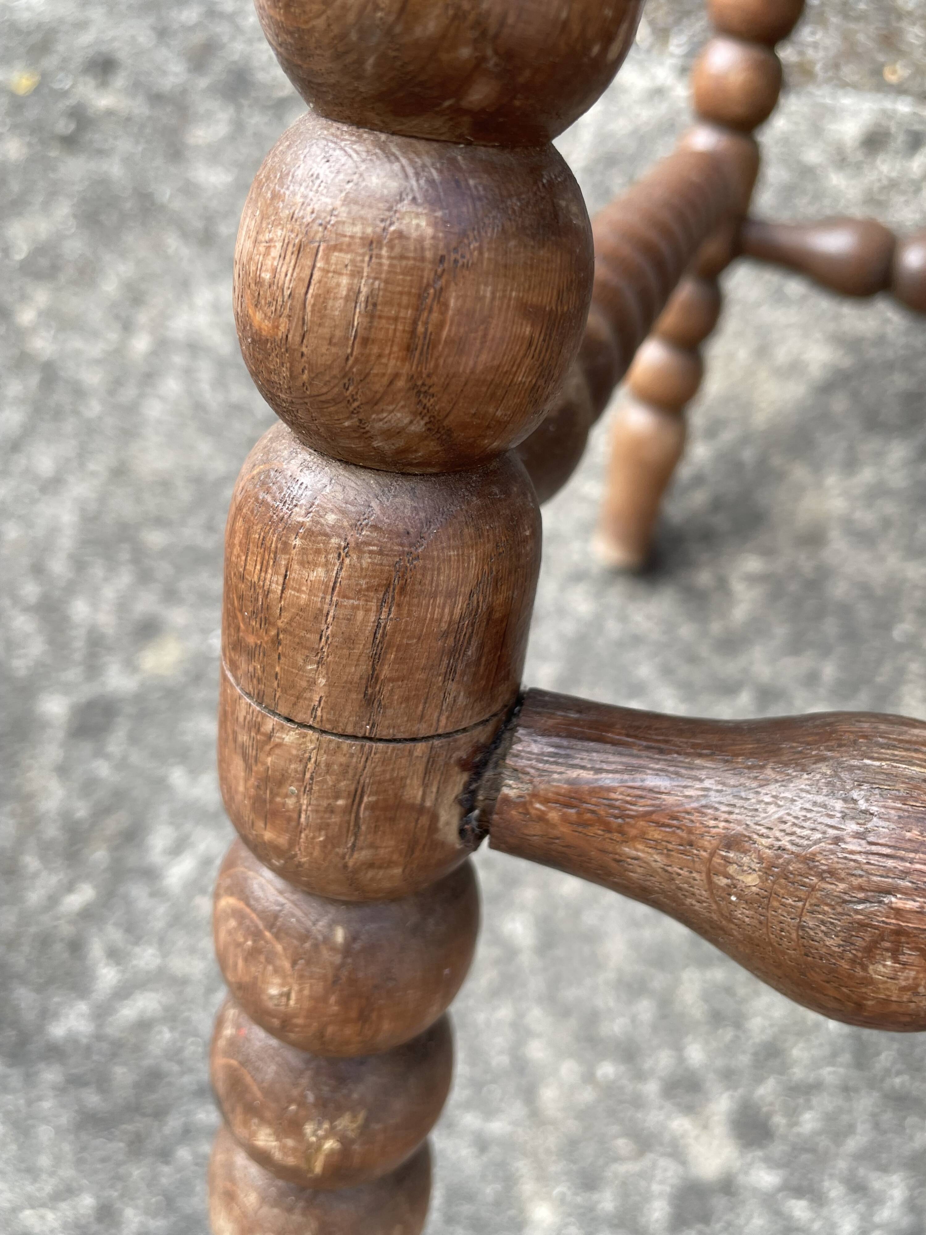 Antique Bobbin armchair with straw seat
