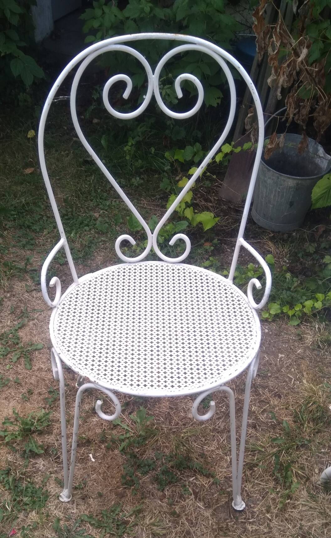 Mategot-style perforated wrought iron garden furniture with table and armchairs