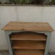Green-grey library, wooden shelf and shelves in natural wood.