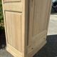 Wooden bonnetière, wardrobe/cupboard in raw wood.