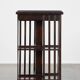 Wooden bookstand with green leather surface and on wheels in English style