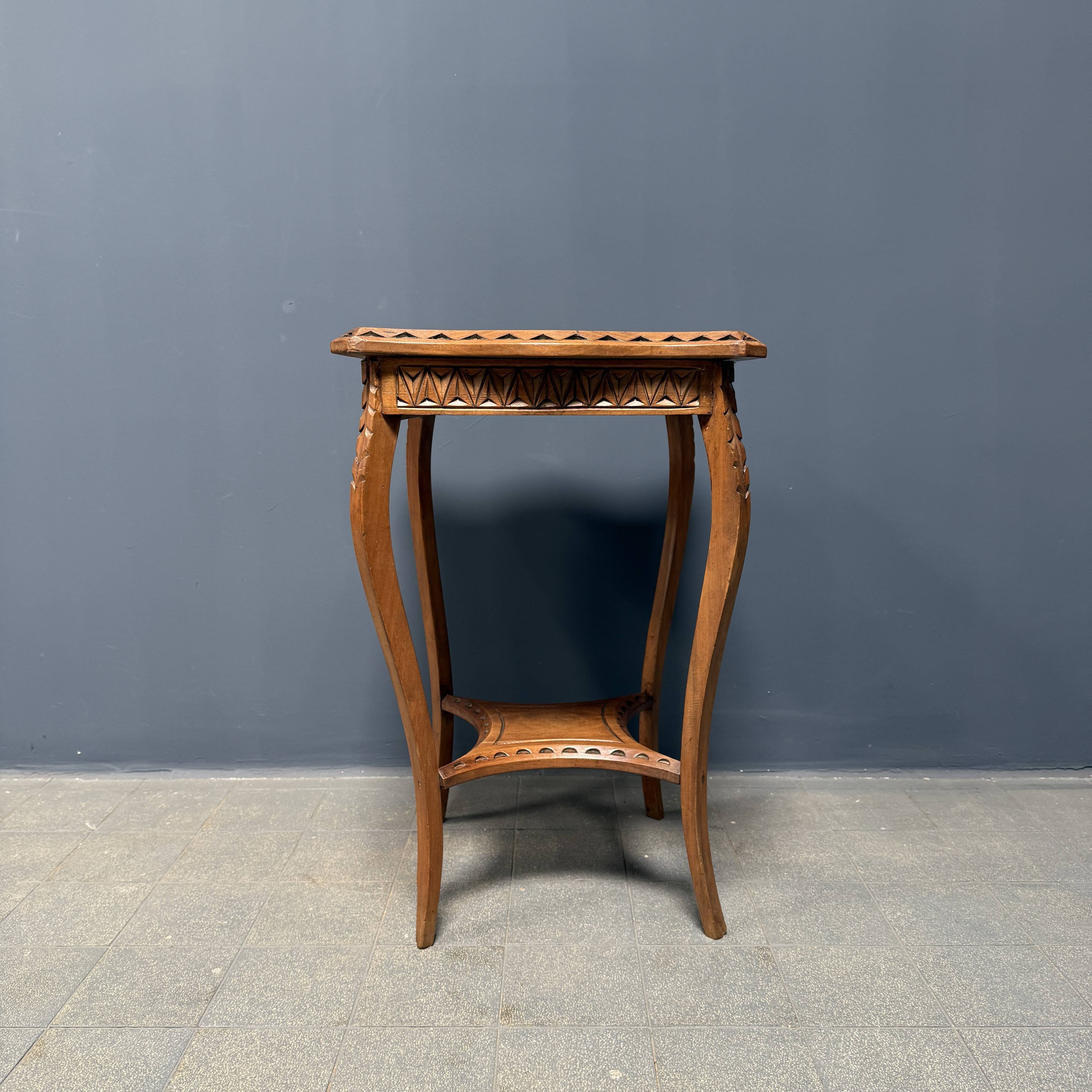 Graceful antique carved wooden side table