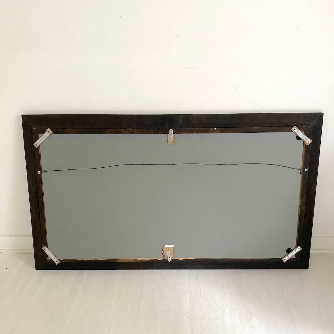 1950s mirror, matte black wood with a patina.