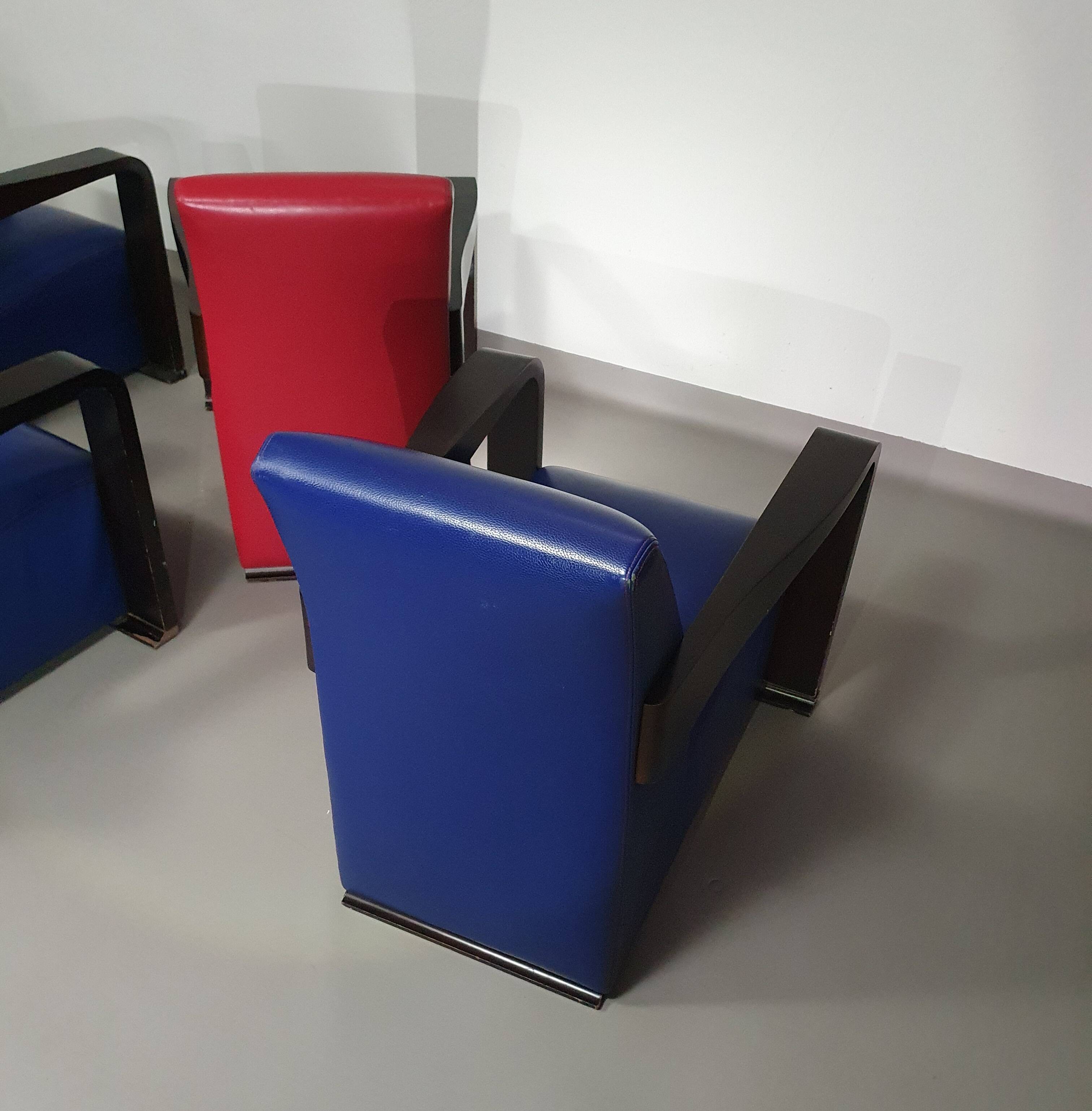 4 x Vintage Ying lounge chairs / fauteuils van Hugues Chevalier,'90. 3 x blue / 1 x red leather