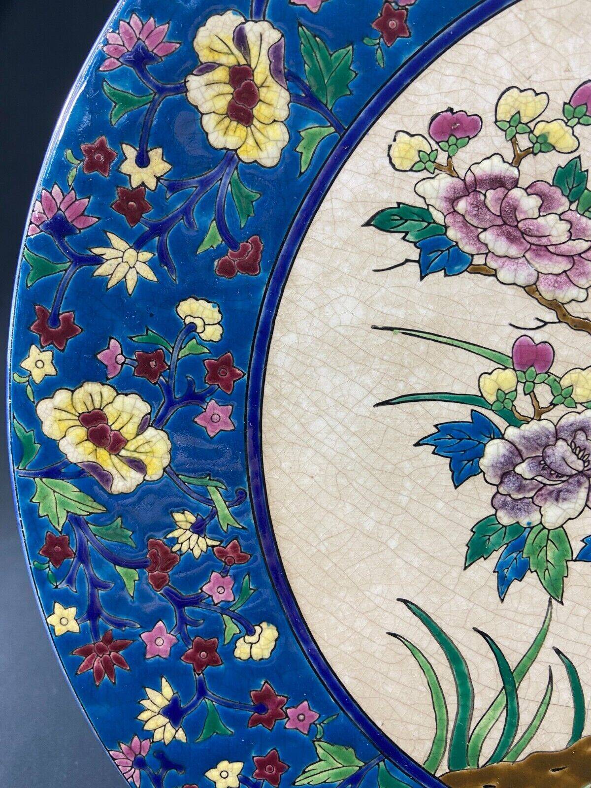 Large circular earthenware dish from Louvière with Longwy style bird decoration