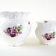 Pair of decorative ceramic vases with hand-painted roses, Art Deco style, European