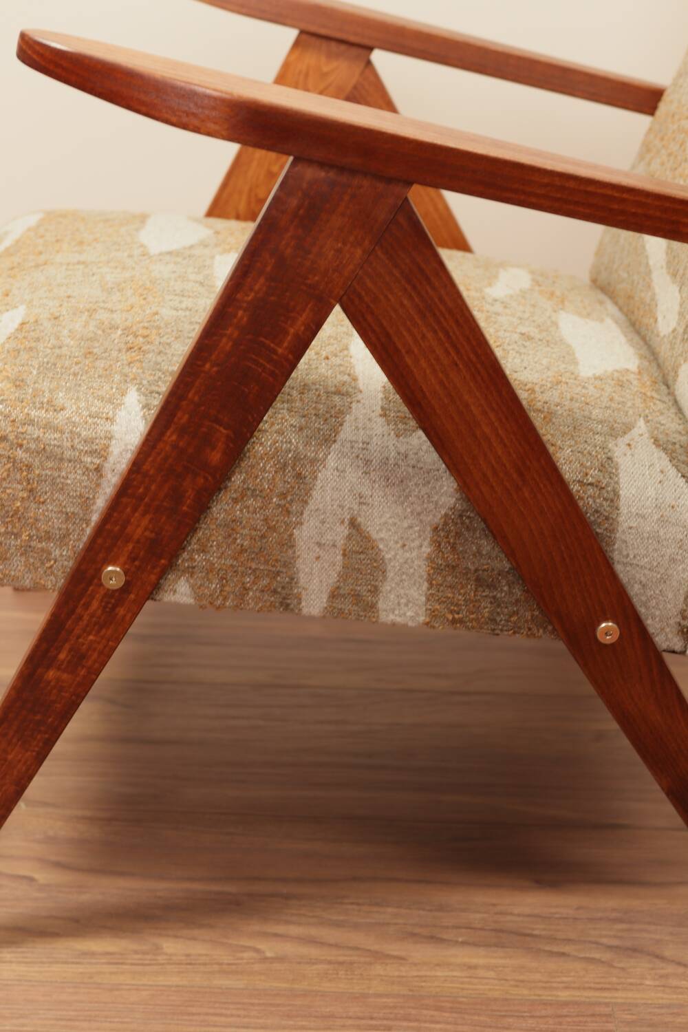 Pair of vintage lounge chairs in brown jacquard fabric and wood.