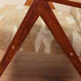 Pair of vintage lounge chairs in brown jacquard fabric and wood.