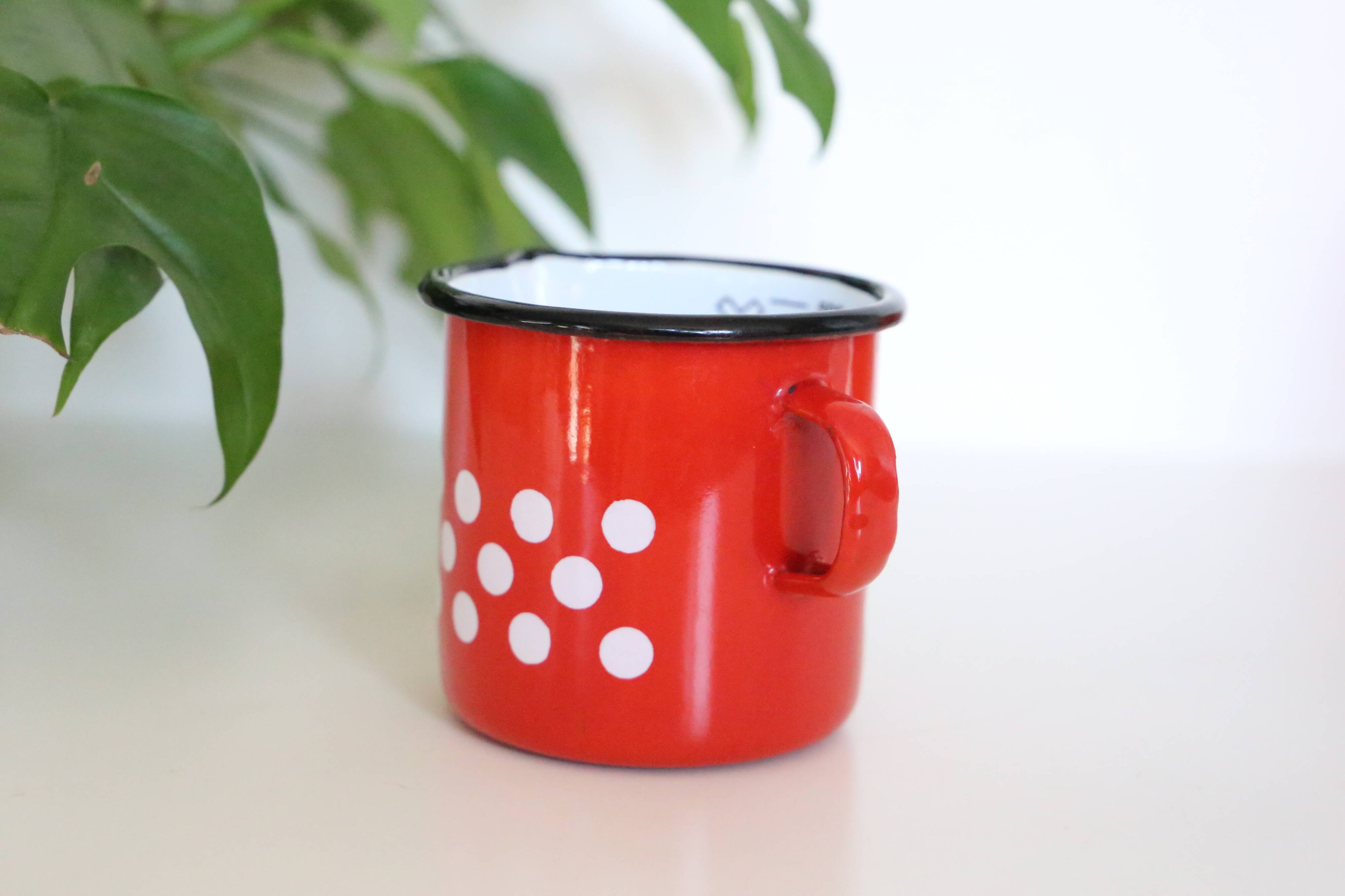 Red enamelled metal milk pot