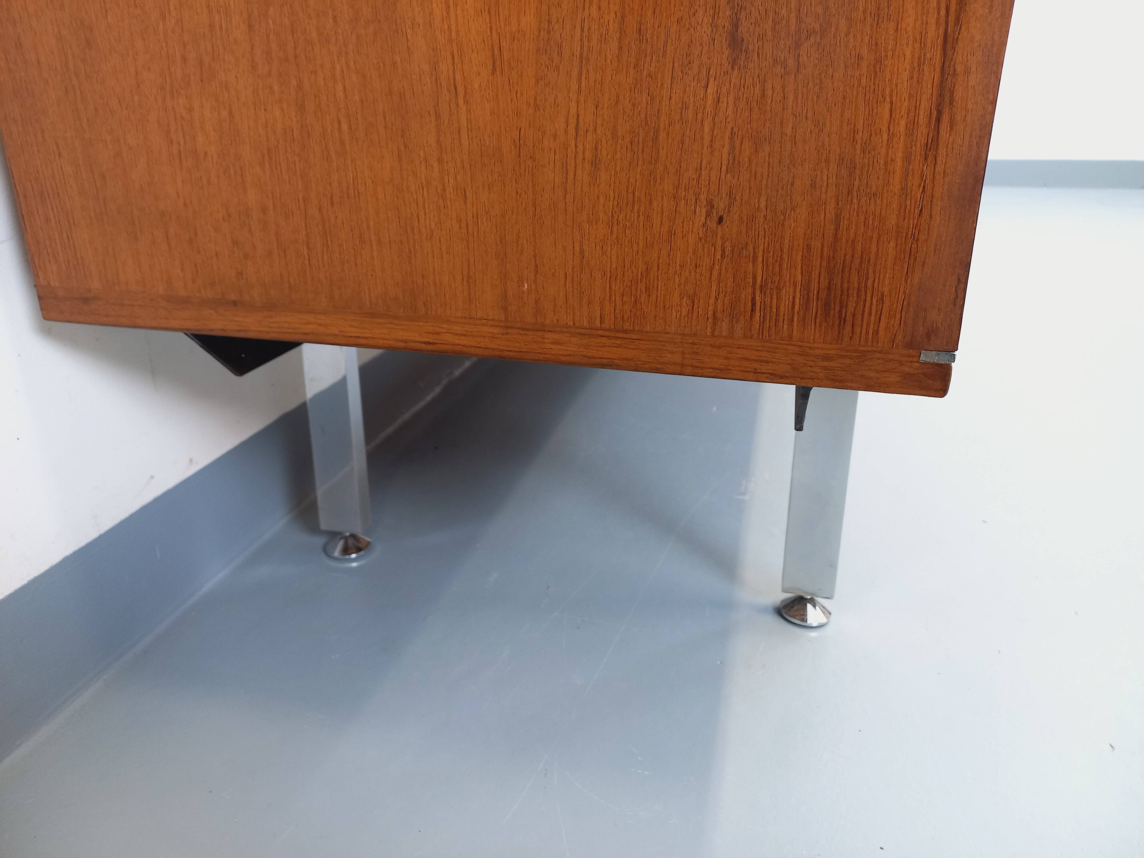 Vintage modernist enfilade in rosewood and chrome metal from the 60s and 70s.