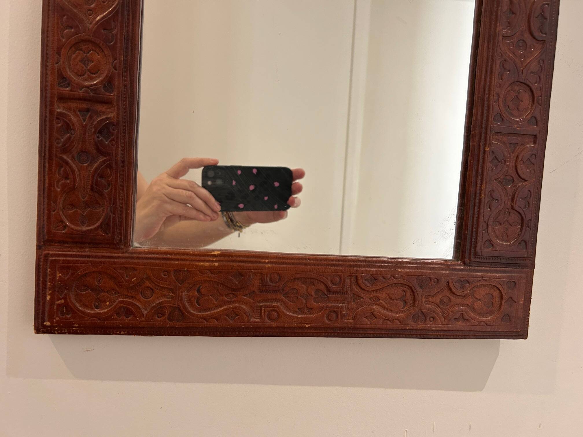 leather repoussé mirror from the 1970s
