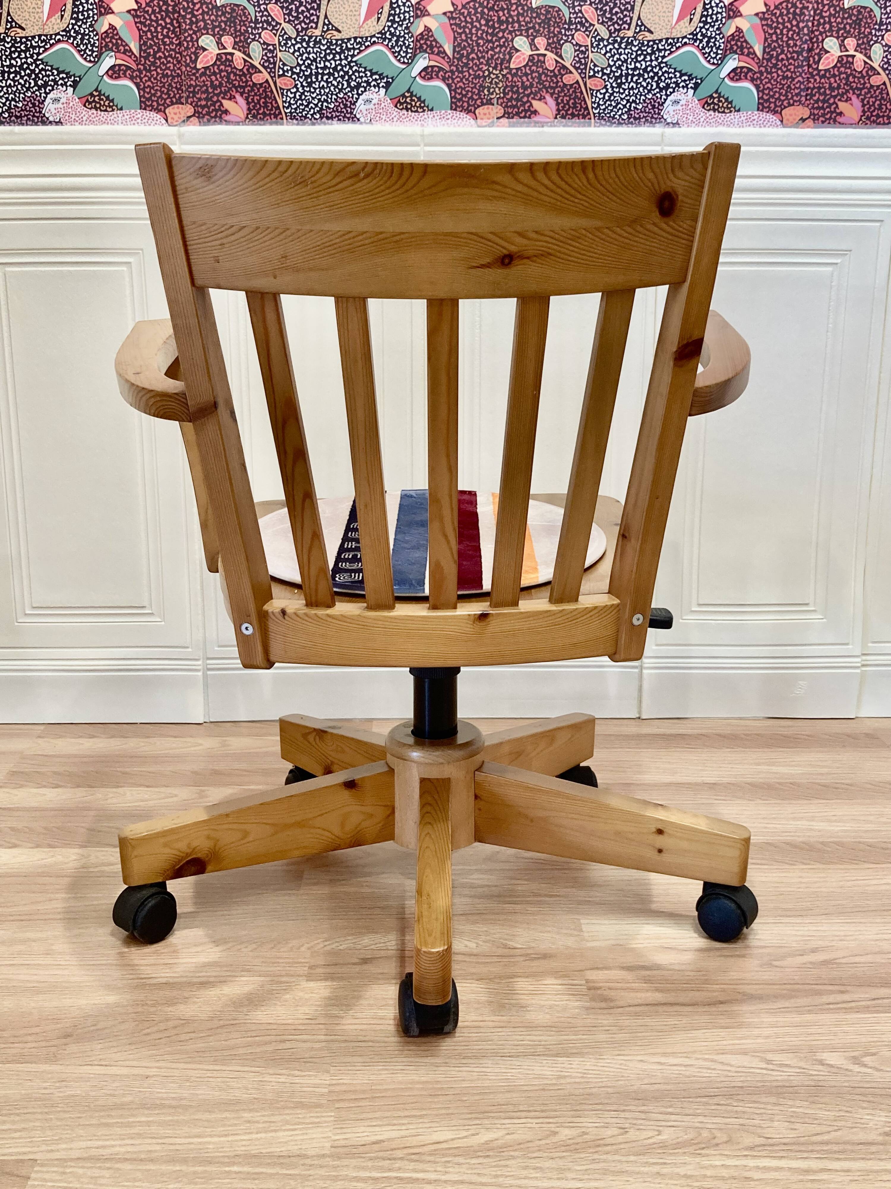 Solid wood swivel and reclining armchair.