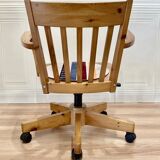 Solid wood swivel and reclining armchair.