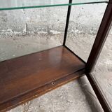 Dark-stained wood and glass vintage display cabinet — early 20th-century wall-mounted showcase