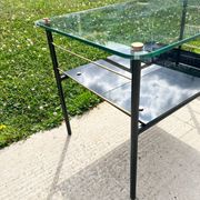 Metal and glass coffee table with magazine rack by Roche Bobois from the 1950s.