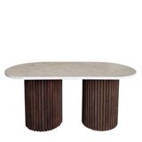 Oval coffee table in travertine and fluted wood.
